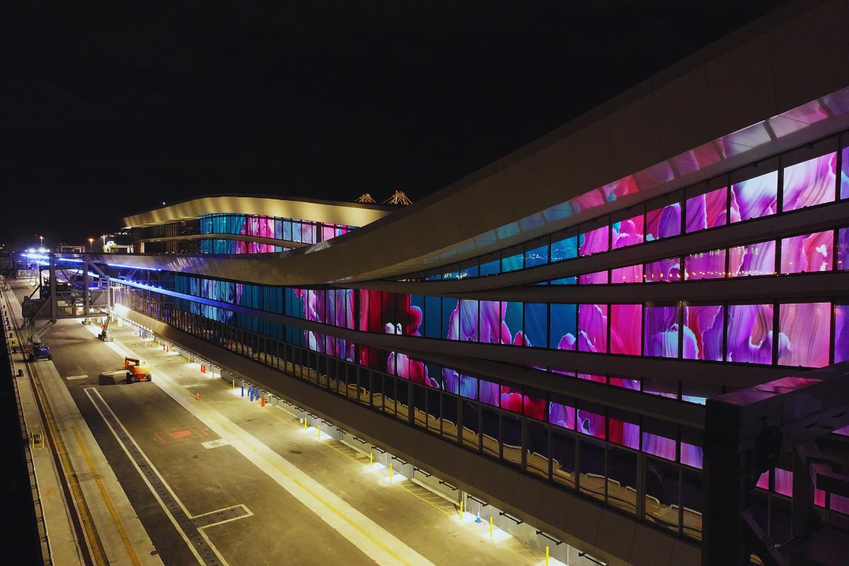 projection mapping on gauzy smart glass exterior of building Miami Florida